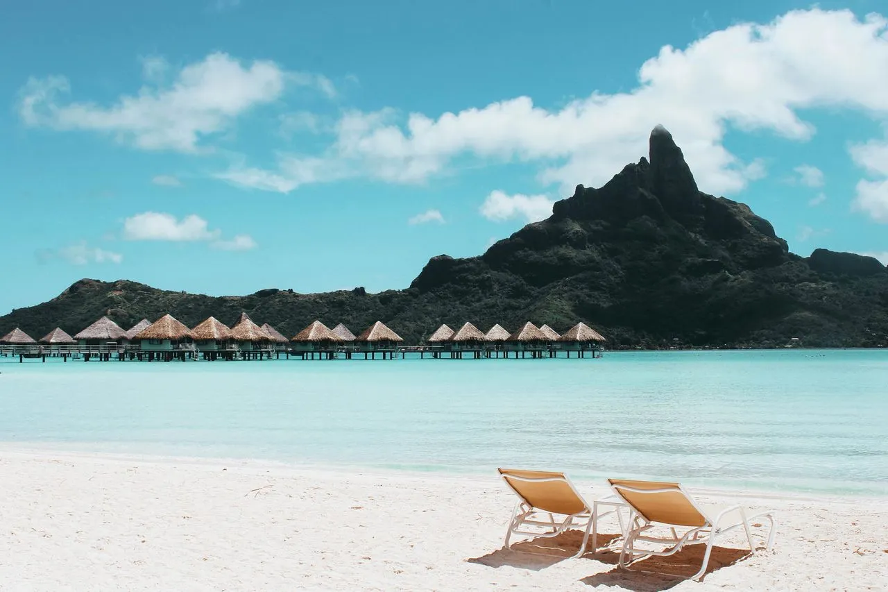 Infinity pool overlooking turquoise Caribbean bay at an all-inclusive resort