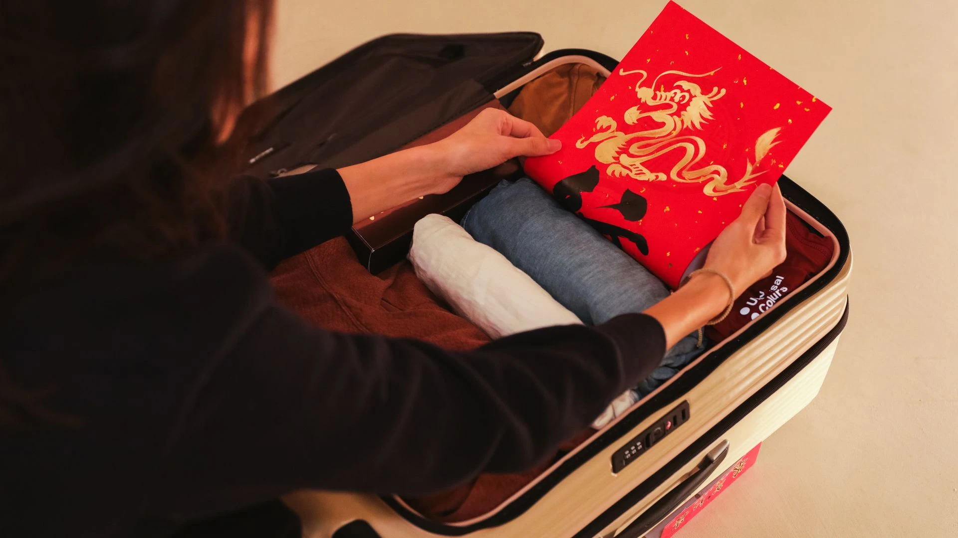 Travel car seat in protective carry bag at airport check in counter with parent and child