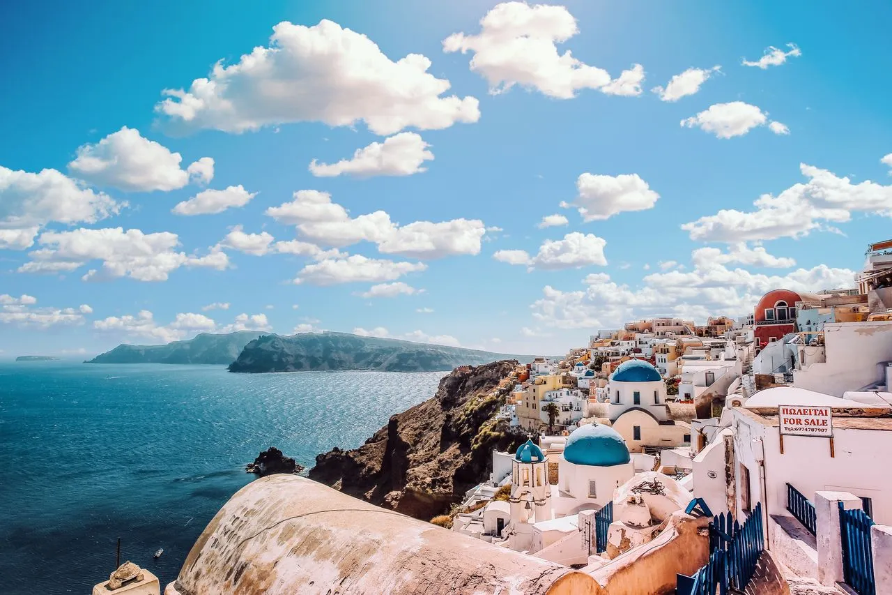 Split view of Dubrovnik and Santorini over the Mediterranean
