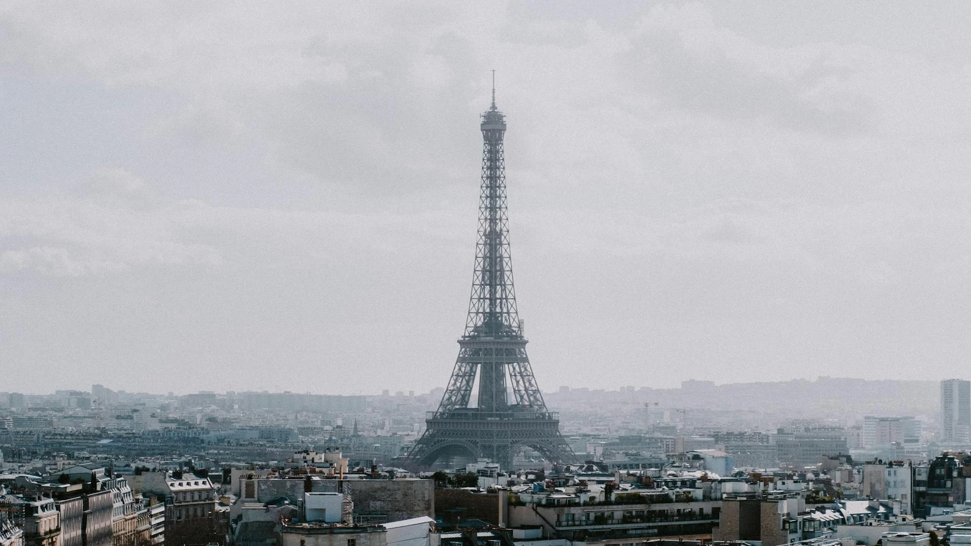 Eiffel Tower Paris at sunset versus Rome Colosseum at golden hour — city comparison